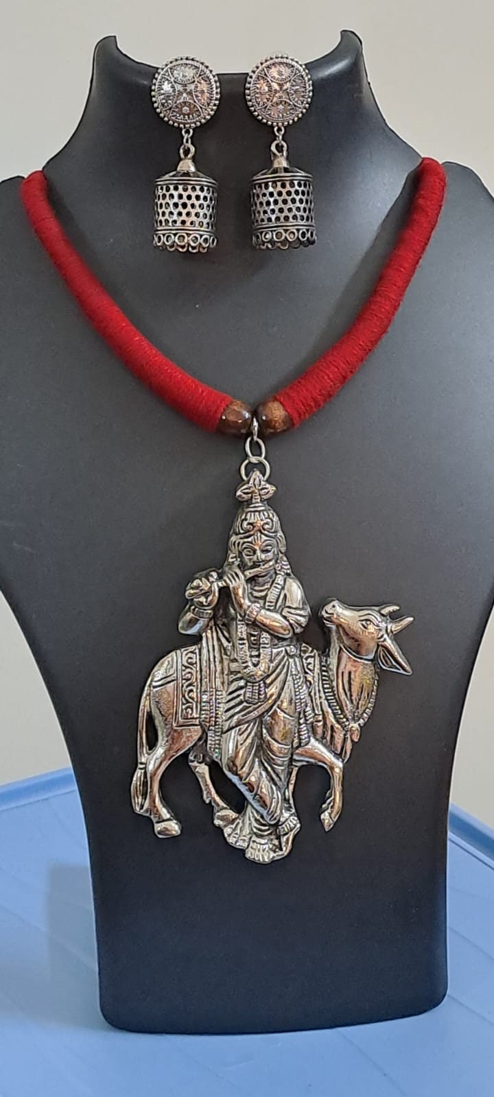 Red thread necklace with silver oxidised krishna pendant