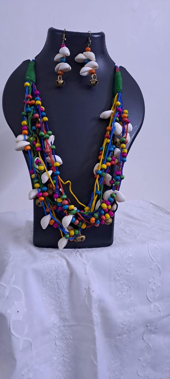 Exclusive multi-coloured and multi-layered thread necklace with shells, wooden beads n trinkets.