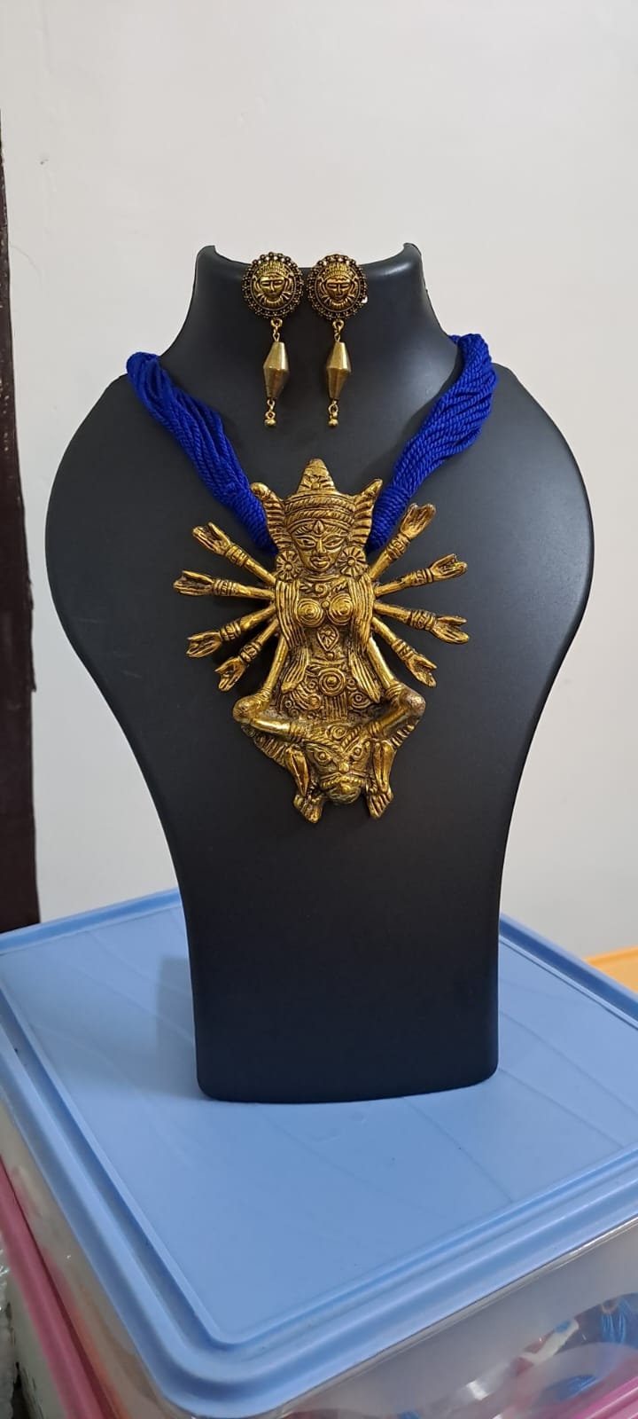 Blue thread necklace with oxidised golden durga pendant