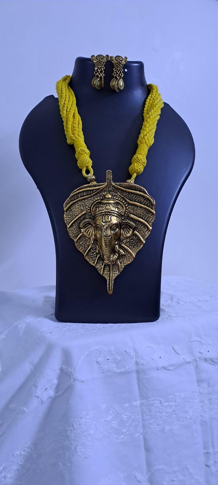 Yellow thread necklace with golden oxidised ganesha pendant
