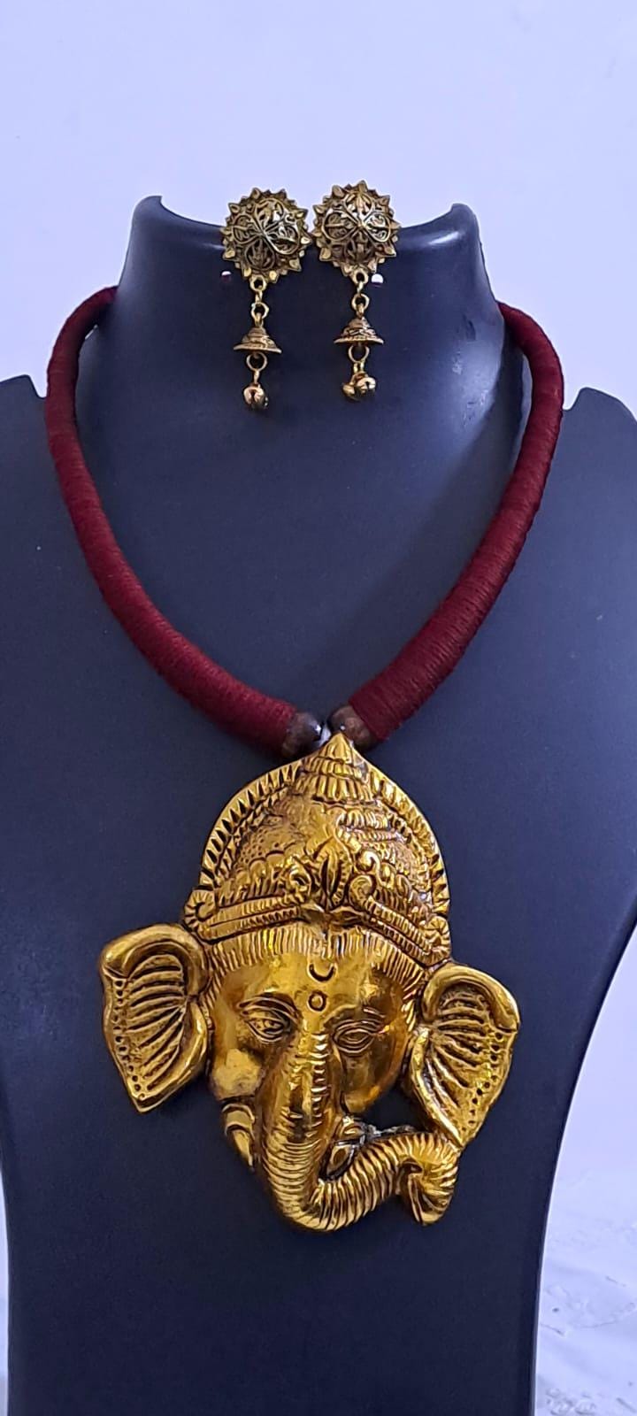 Maroon thread necklace with golden oxidised ganesha pendant