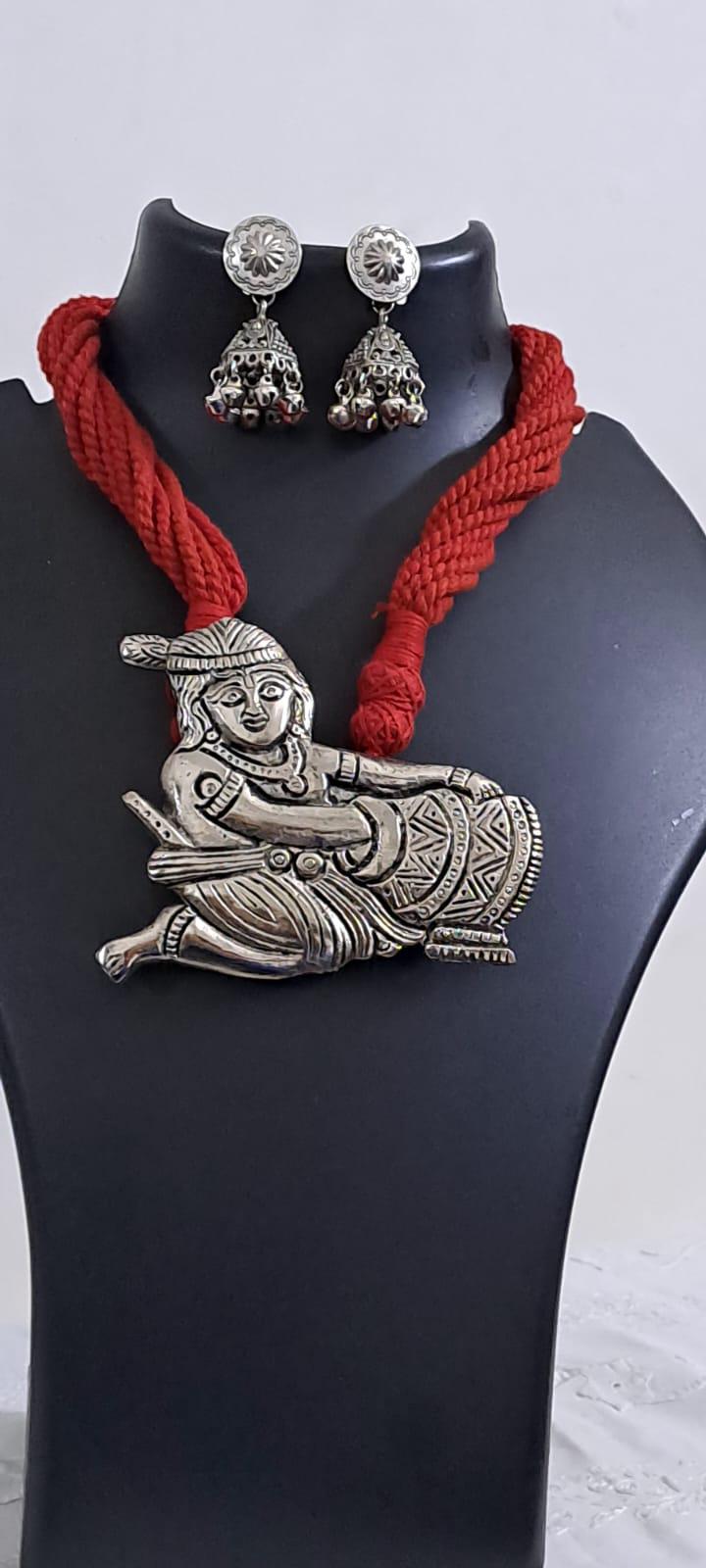 Red thread necklace with silver oxidised krishna pendant