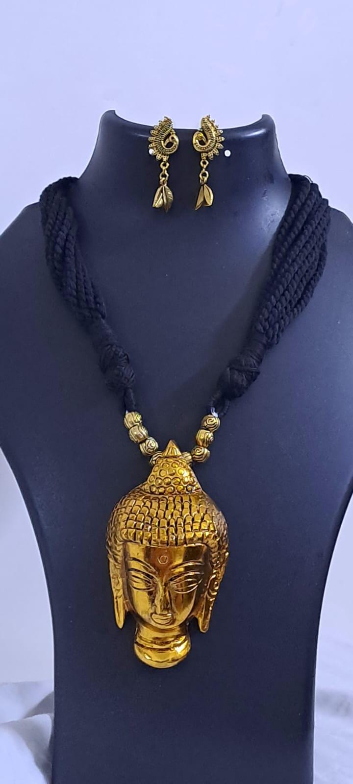 Black thread necklace with oxidised golden buddha pendant