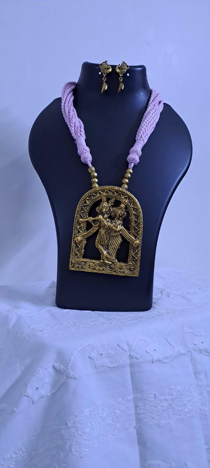 Radha Krishna golden oxidised pendant necklace in pink tread with matching earrings