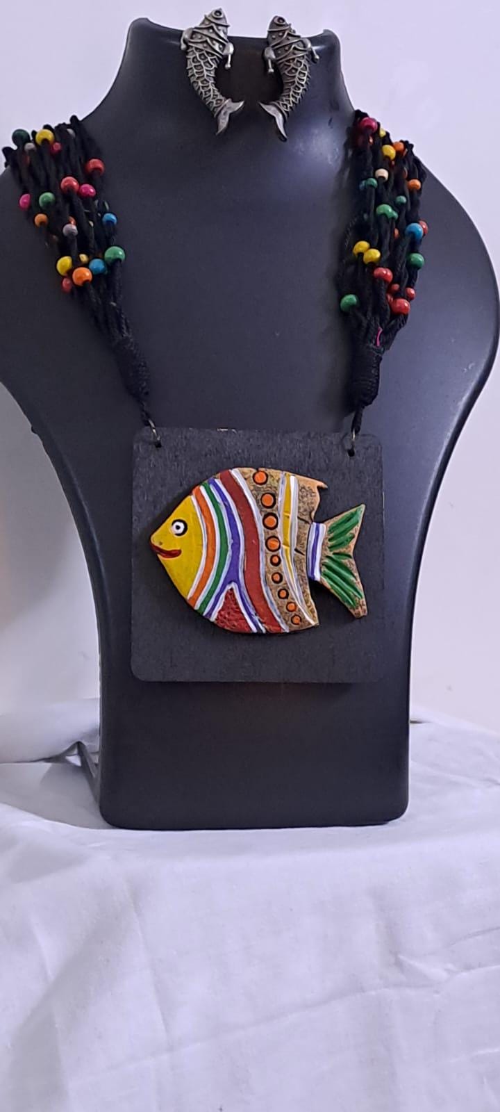 Terracotta fish pendant and thread necklace