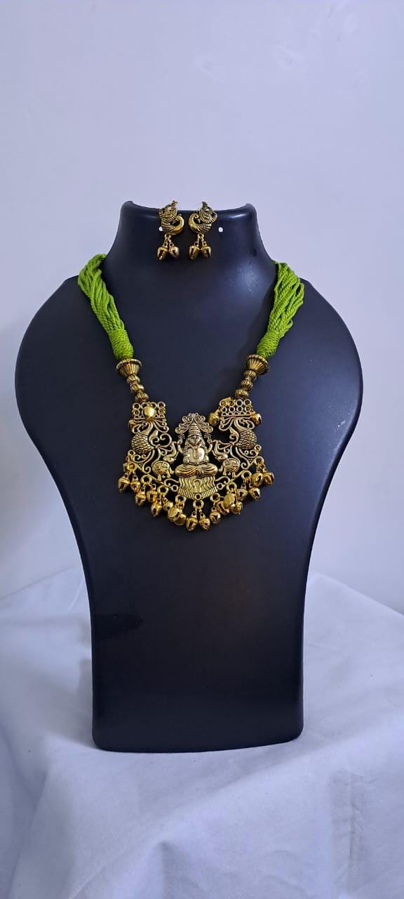 Light green thread necklace with Golden oxidised traditional pendant