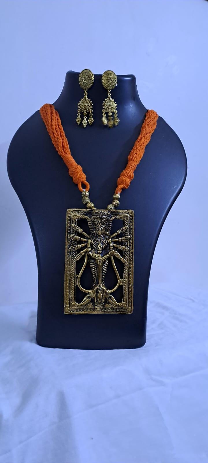 Orange thread necklace with oxidised golden durga pendant
