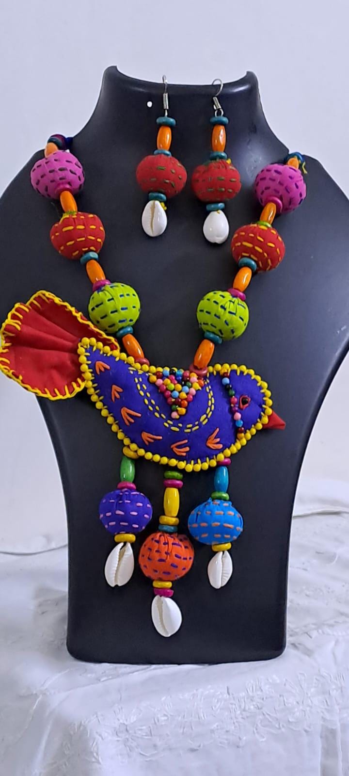 Exclusive fabric necklace with embroidered blue fabric bird pendant and fabric beads n matching beads