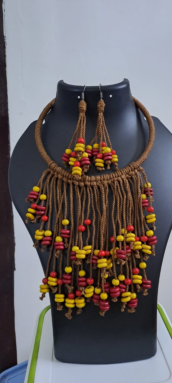 Exclusive brown thread neckband with fringes and matching earrings.