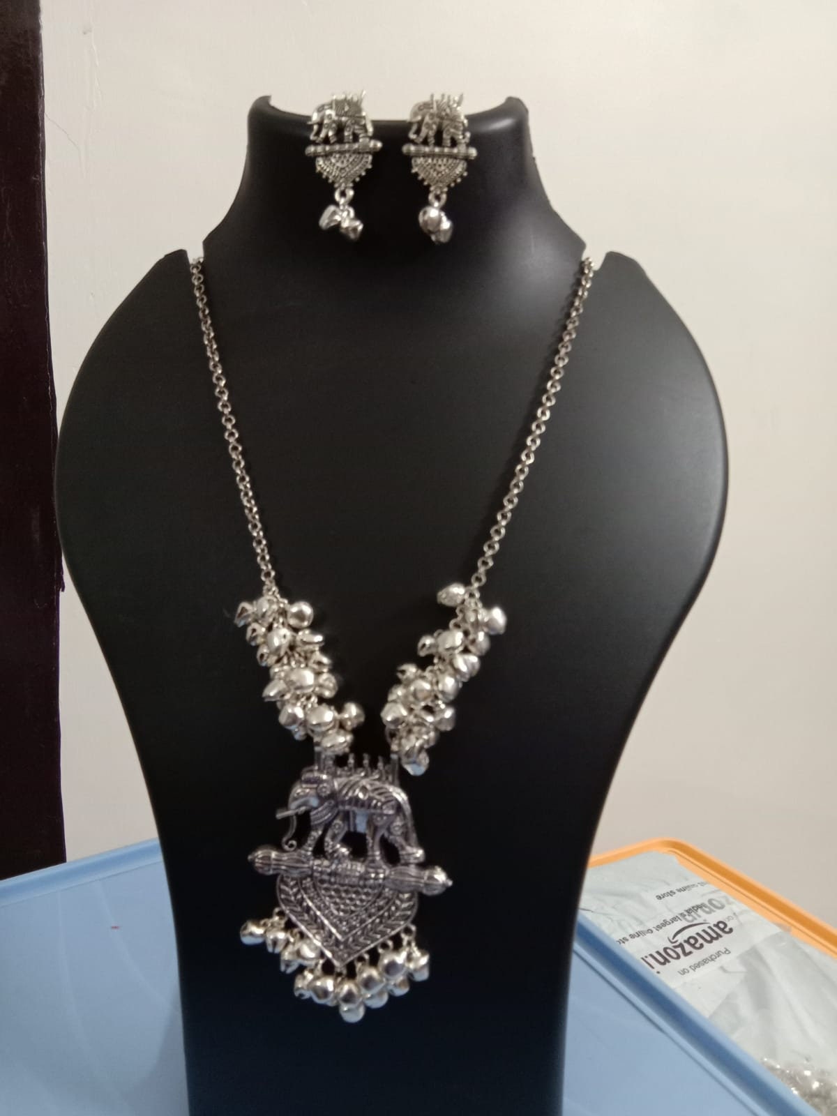 Oxidised silver chain with traditional pendant and matching earrings.