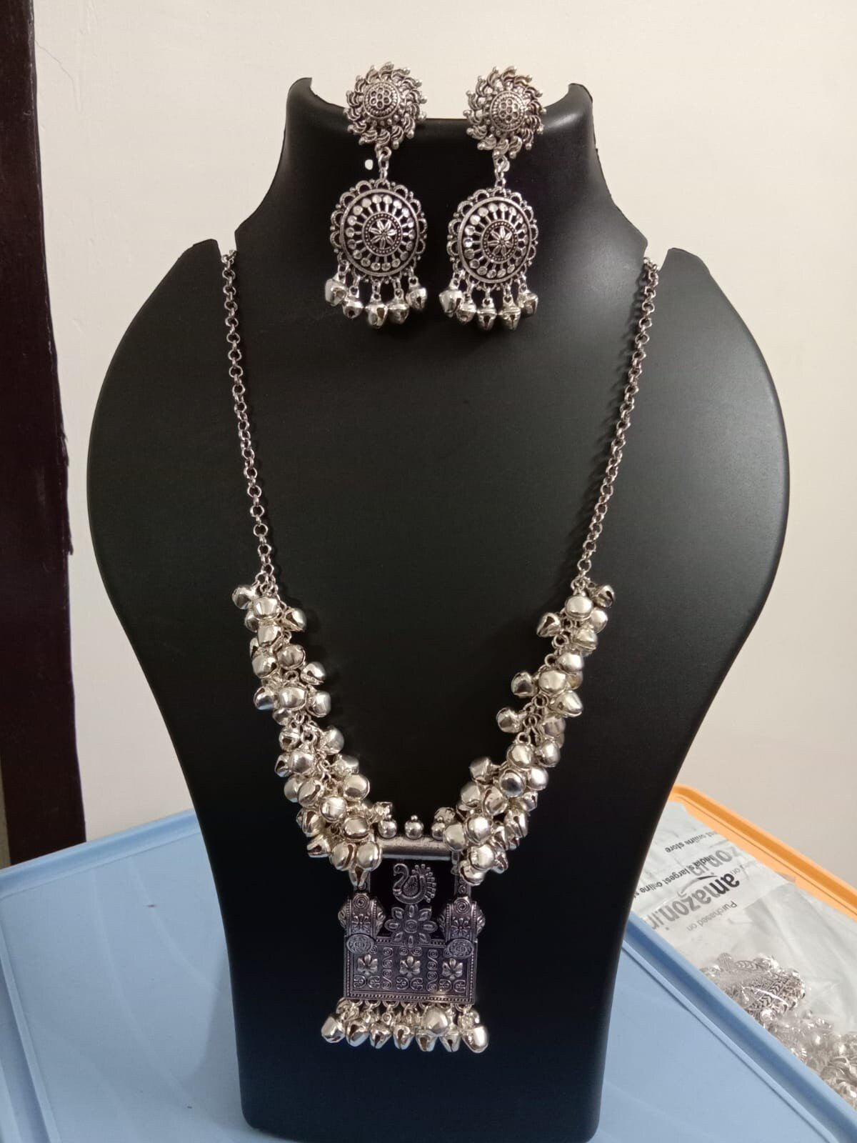 Oxidised silver chain with traditional pendant and matching earrings.
