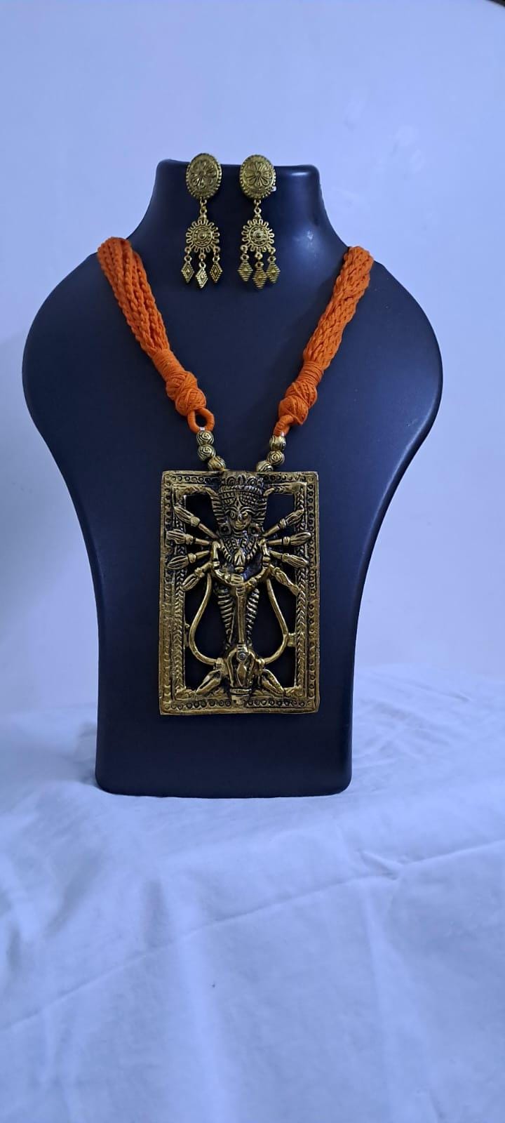 Orange thread necklace with oxidised golden durga pendant
