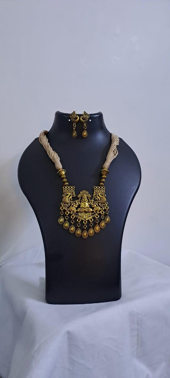Off white thread necklace with Golden oxidised traditional pendant
