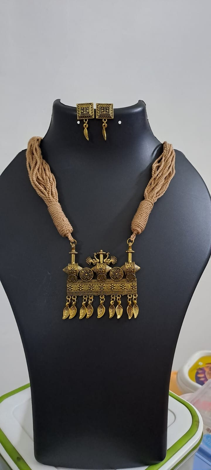 Peach thread necklace with Golden oxidised traditional pendant