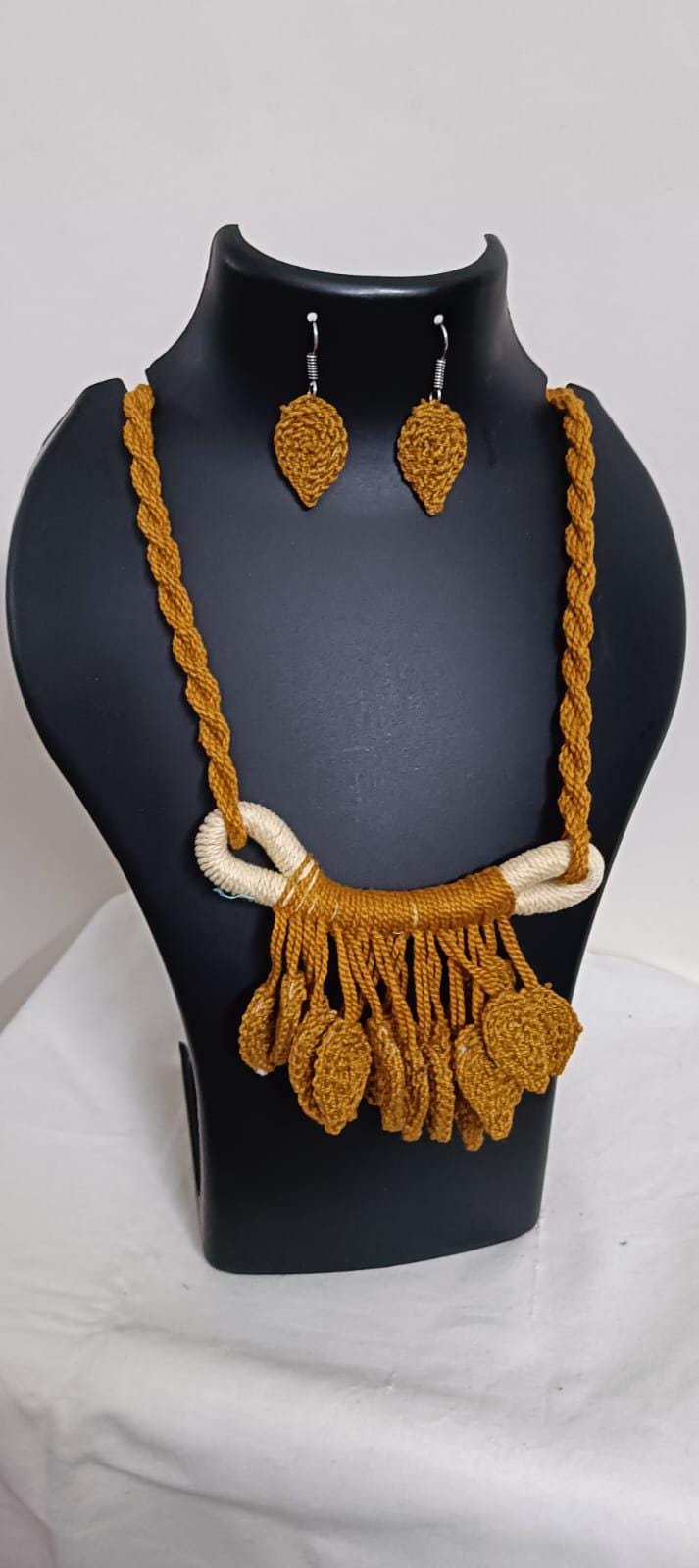Golden brown Crochet thread necklace set with leaf fringes and matching earrings