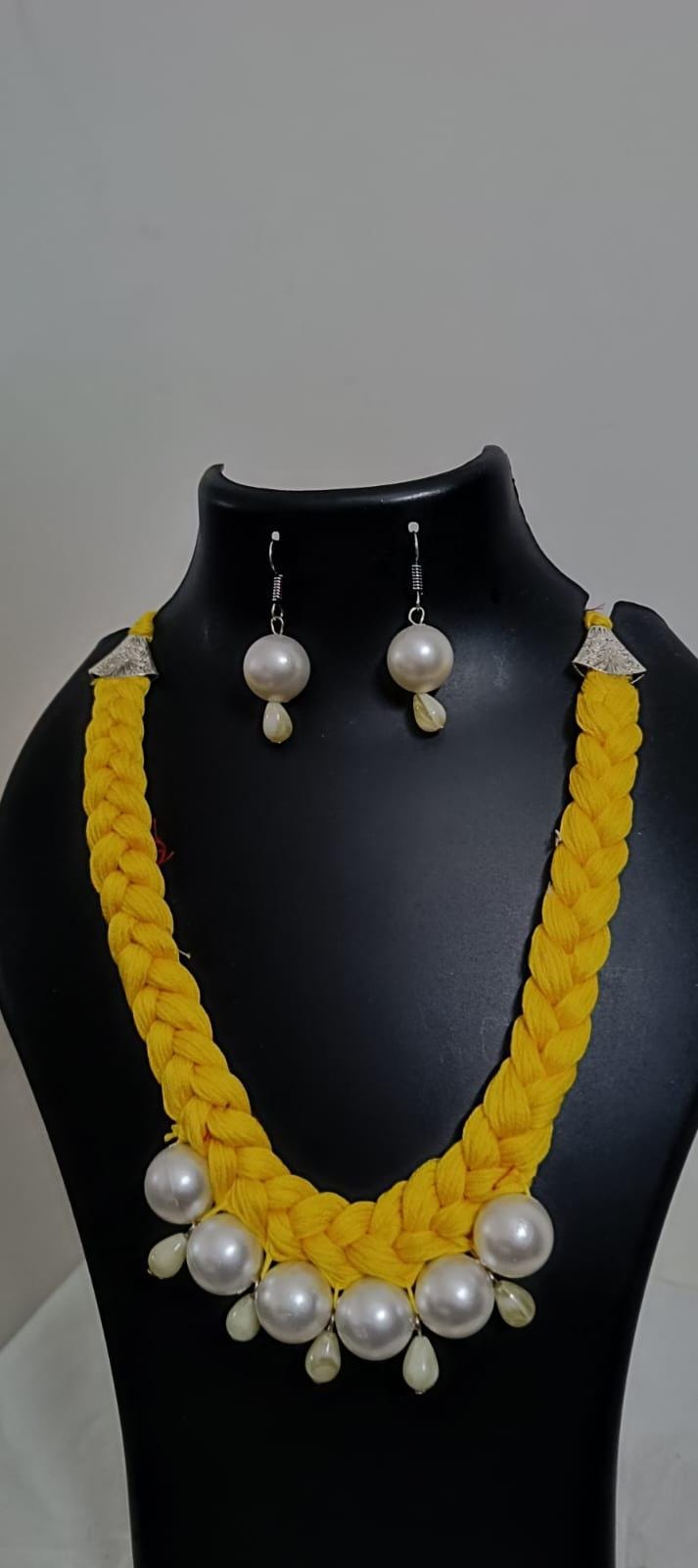 Yellow  braided thread necklace with pearl n pearl danglers