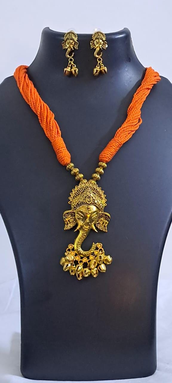 Orange thread necklace with Golden oxidised traditional pendant