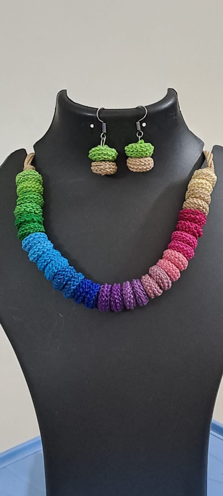 Exclusive multi coloured crochet necklace with colouful matching earrings.