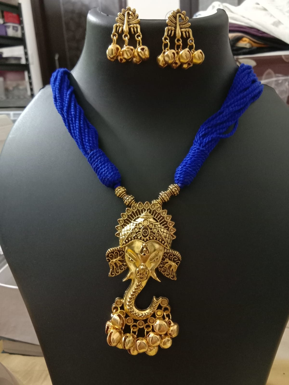 Oxidised golden ganesha traditional pendant and matching earrings.