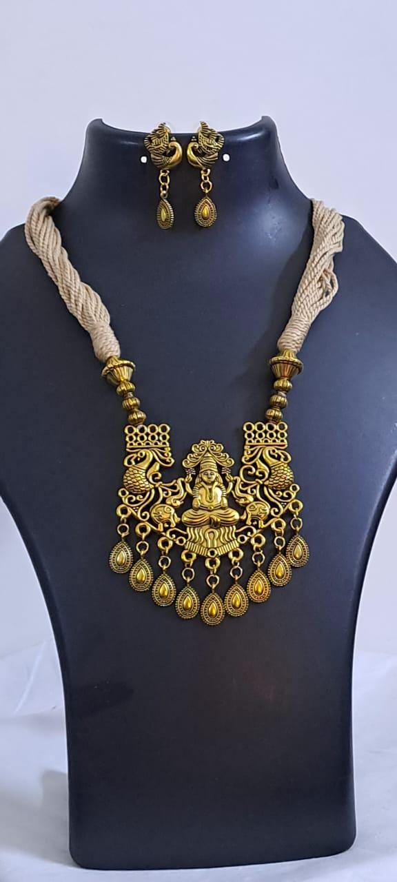 Off white thread necklace with Golden oxidised traditional pendant