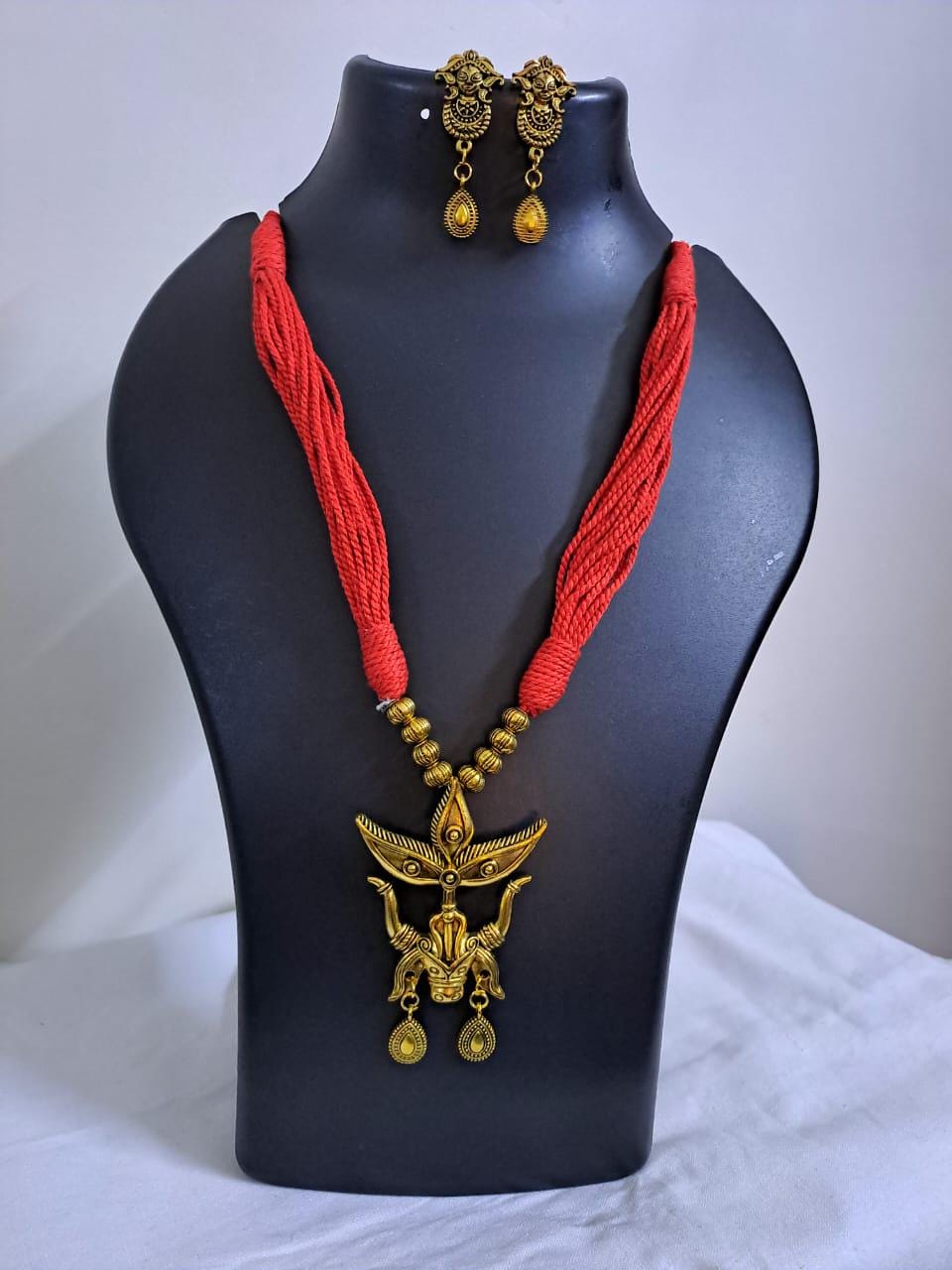 Red thread necklace with golden oxidised Durga pendant n matching earrings
