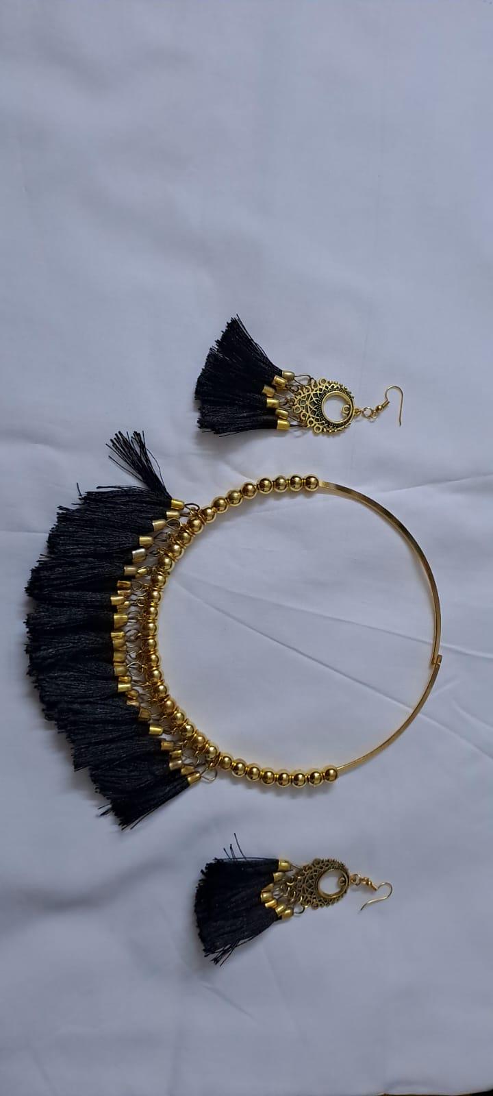 Golden neckband with black silk thread fringes and matching earrings