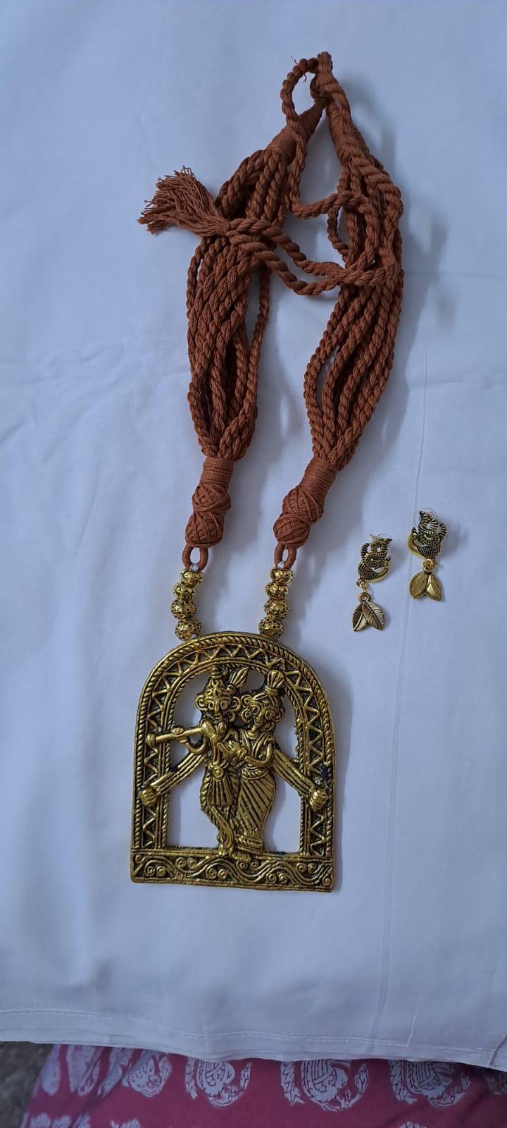 Radha Krishna golden oxidised pendant necklace in brown tread with matching earrings