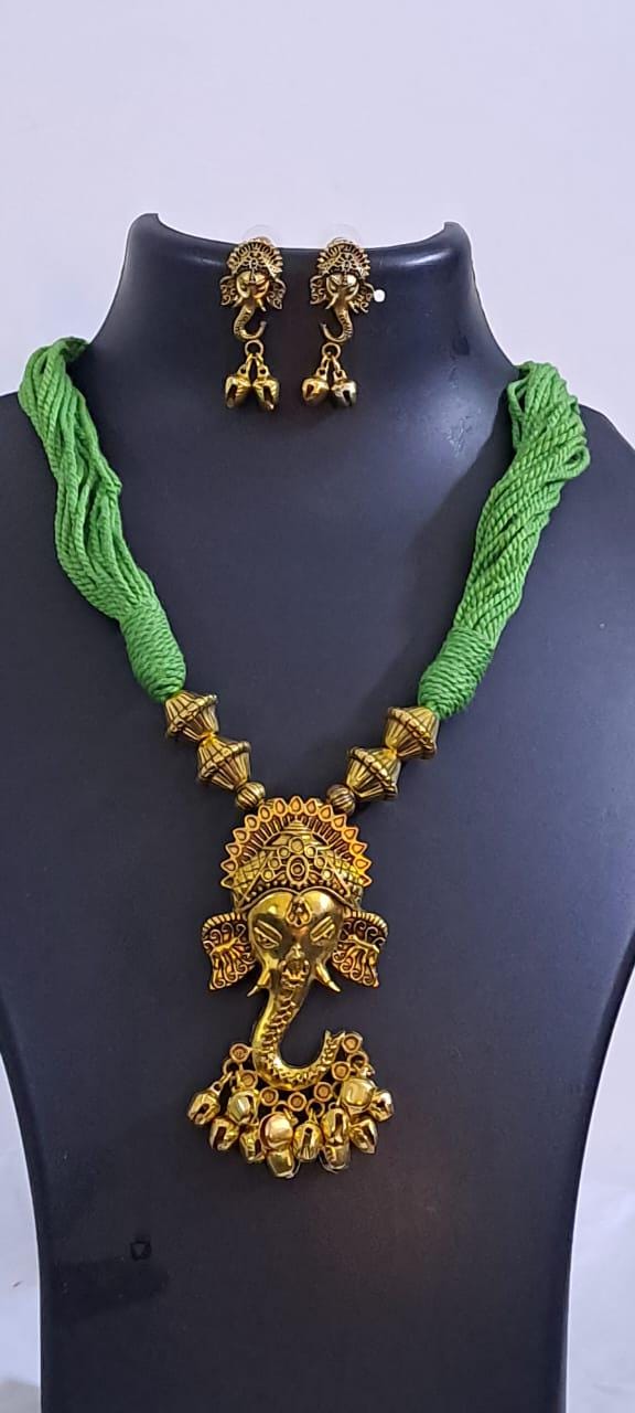 Green thread necklace with Golden oxidised traditional pendant