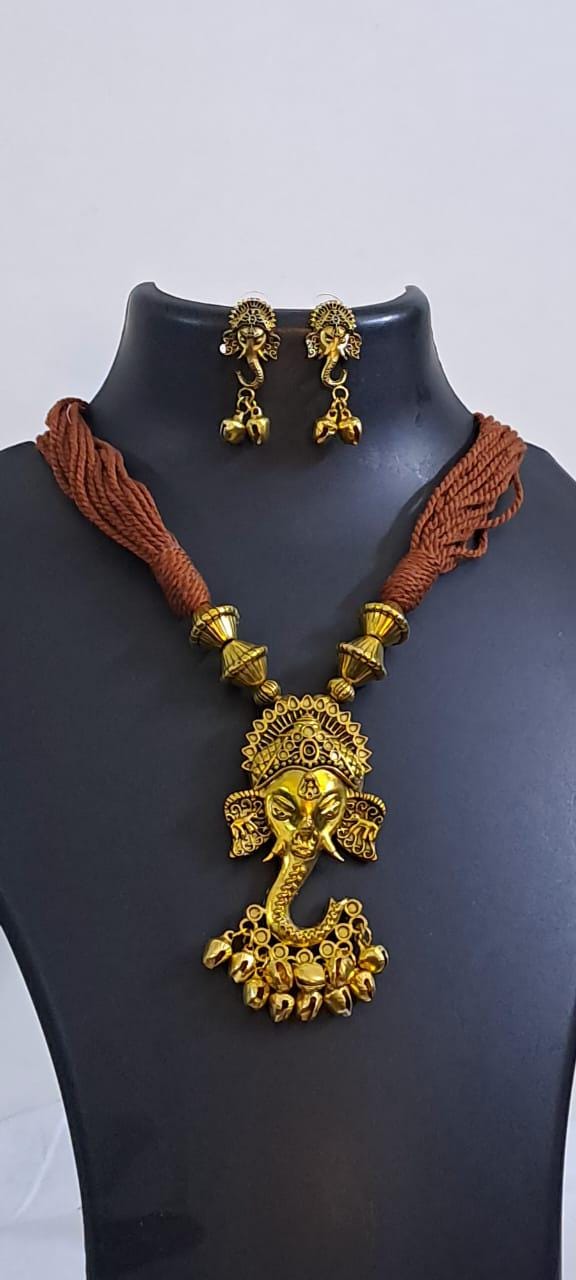 Brown thread necklace with Golden oxidised traditional pendant