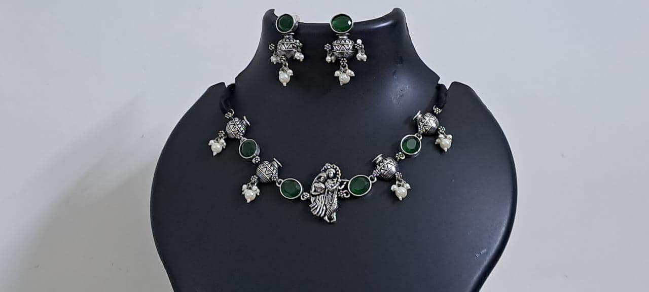 Exclusive silver oxidised lstone necklace with radha krishna pendant with matching earrings