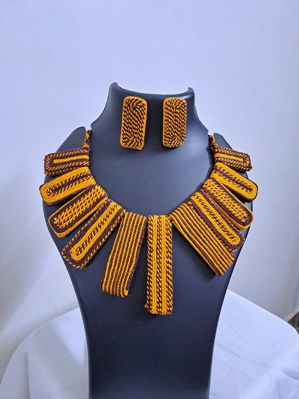 Exclusive brown n yellow thread necklace with rectangle shape thread beads and matching earrings.