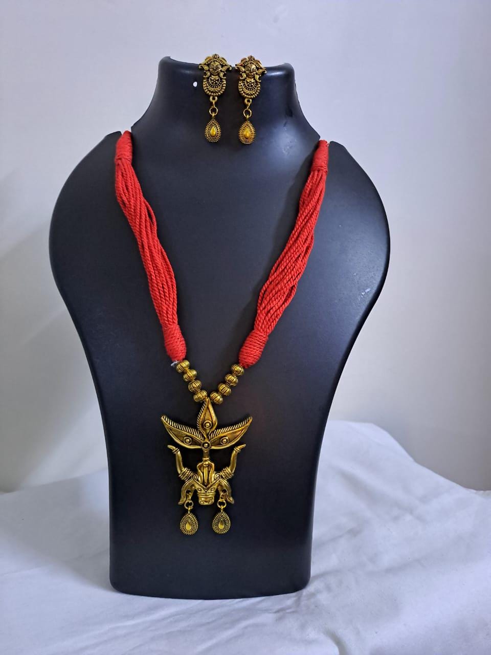Red thread necklace with golden oxidised Durga pendant n matching earrings