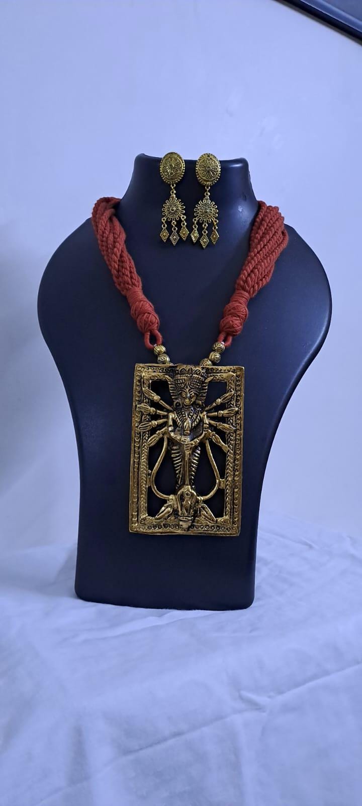 Brown  thread necklace with oxidised golden durga pendant