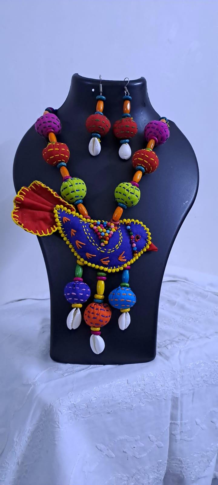 Exclusive fabric necklace with embroidered blue fabric bird pendant and fabric beads n matching beads