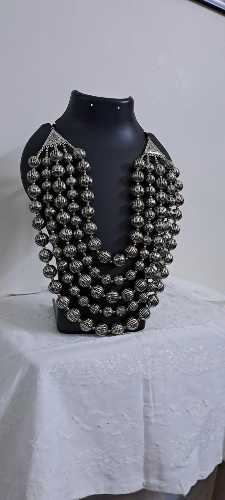 Multi-layered silver oxidised beads necklace .