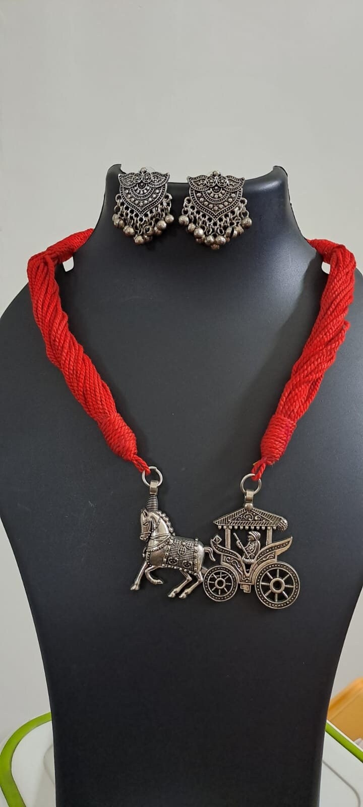 Red thread necklace with silver oxidised traditional pendant