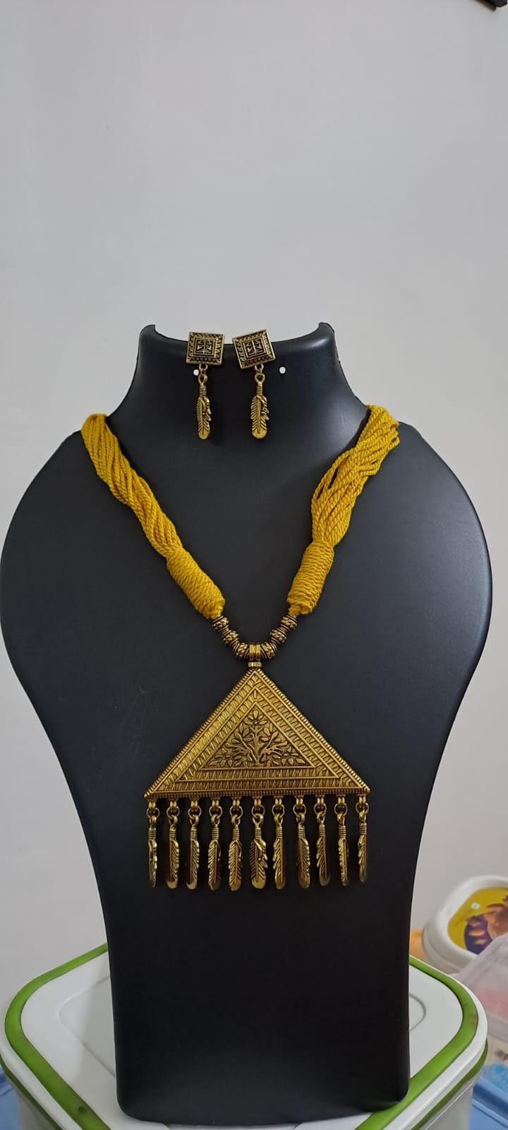 Yellow thread necklace with Golden oxidised traditional pendant
