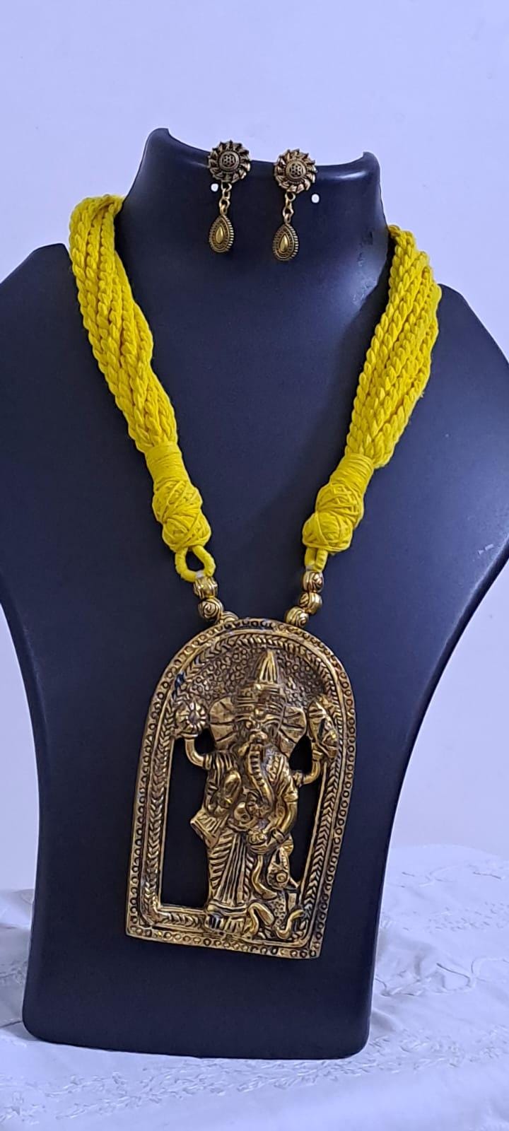 Yellow thread necklace with golden oxidised ganesha pendant