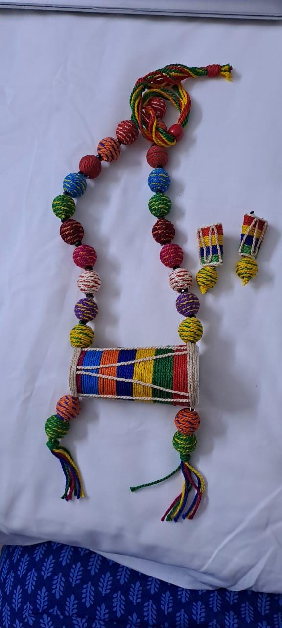 Multi coloured thread beads necklace set with dholak pendant and matching earrings