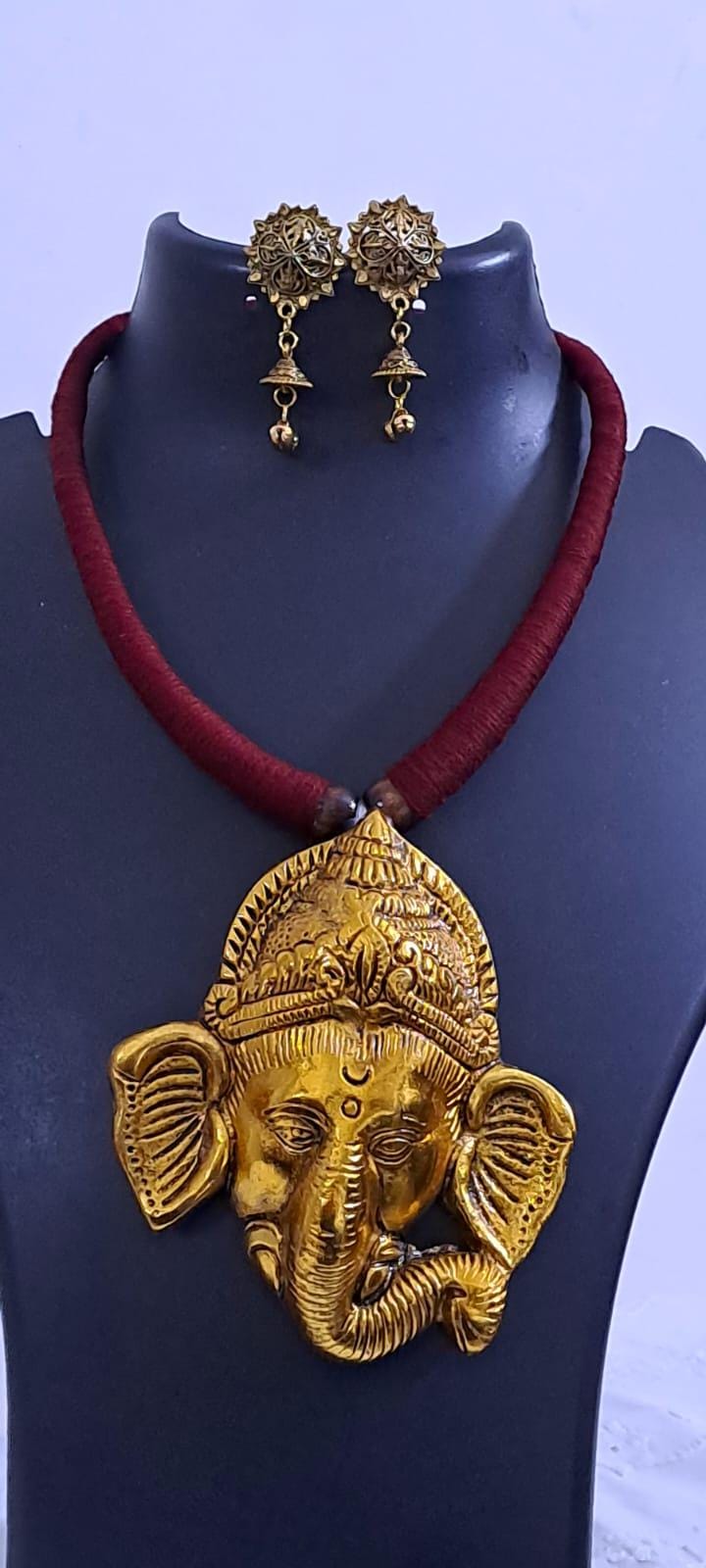 Maroon thread necklace with golden oxidised ganesha pendant