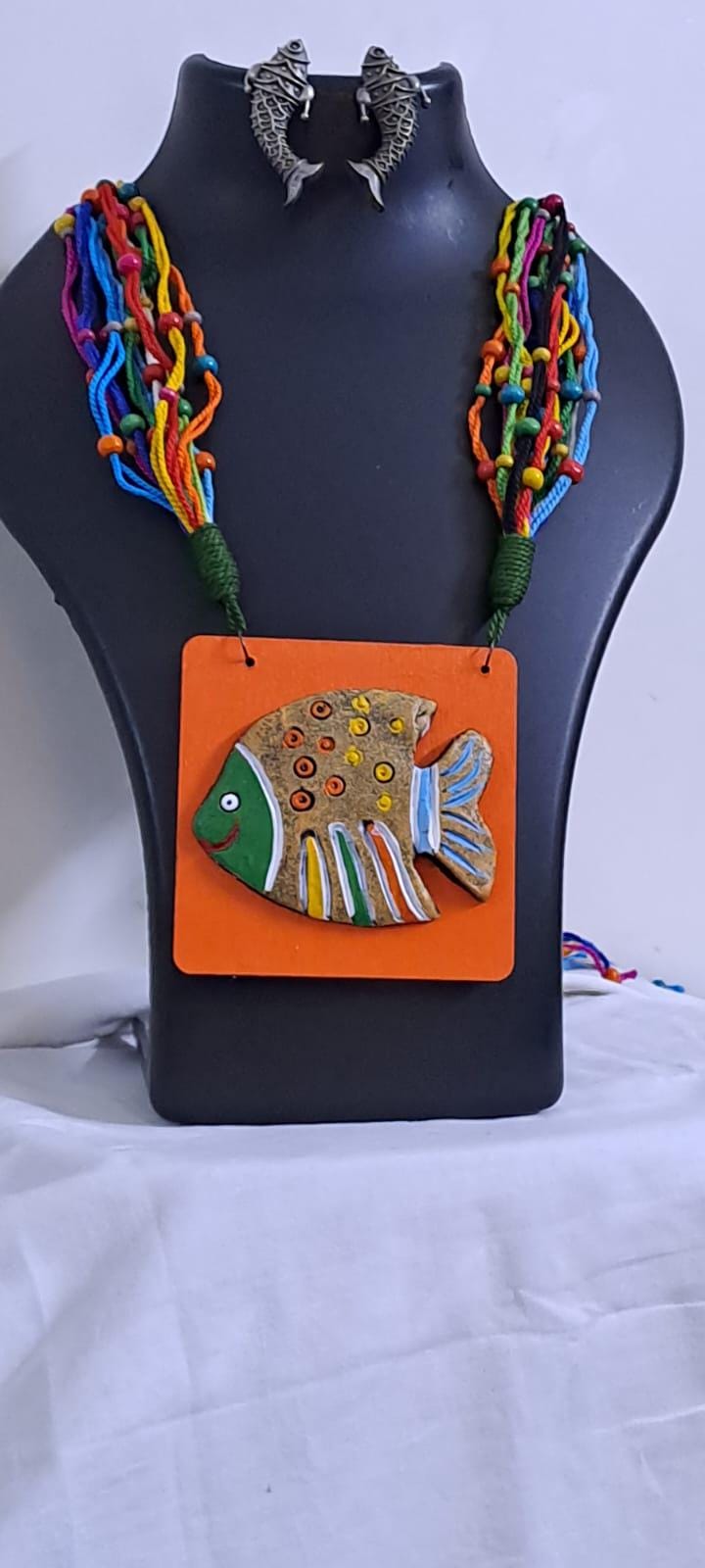 Terracotta fish pendant and thread necklace