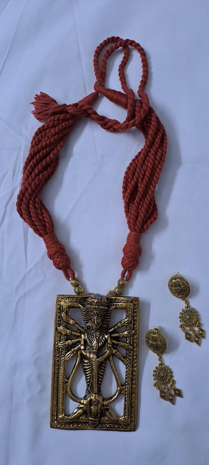 Brown  thread necklace with oxidised golden durga pendant