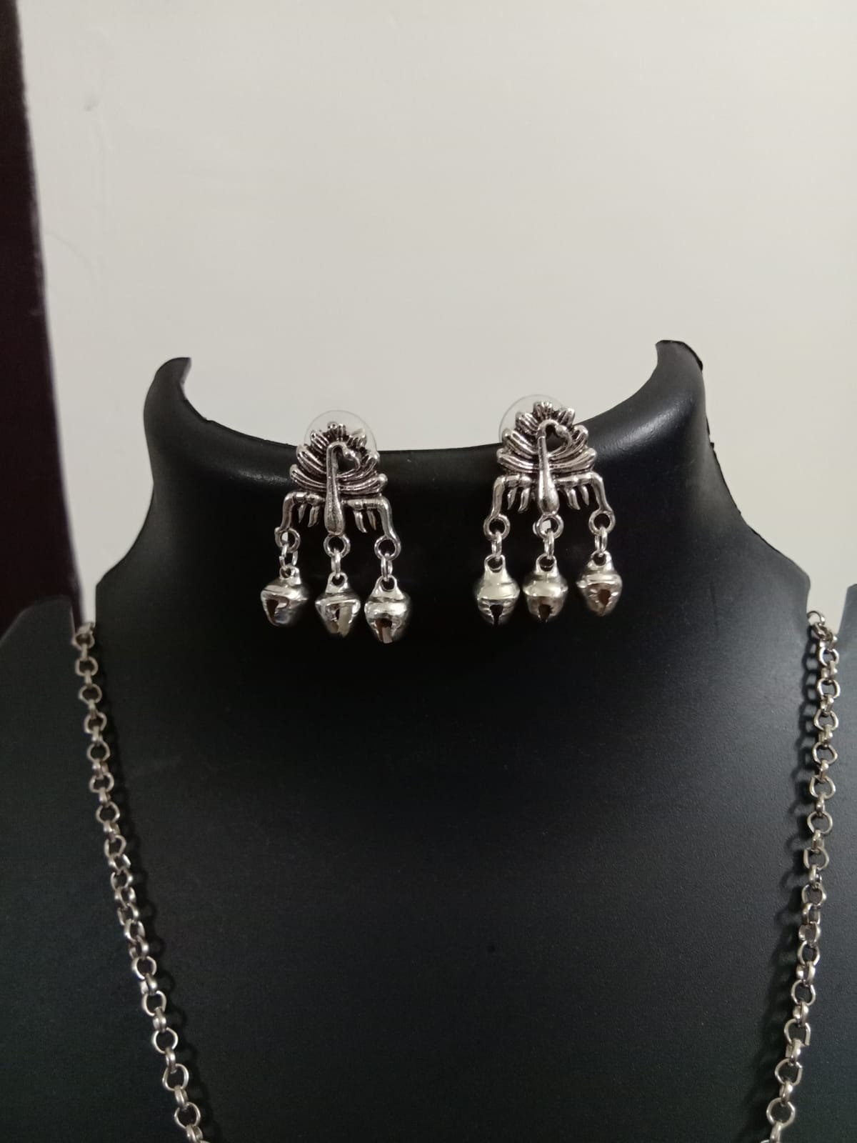 Oxidised silver chain with traditional pendant and matching earrings.