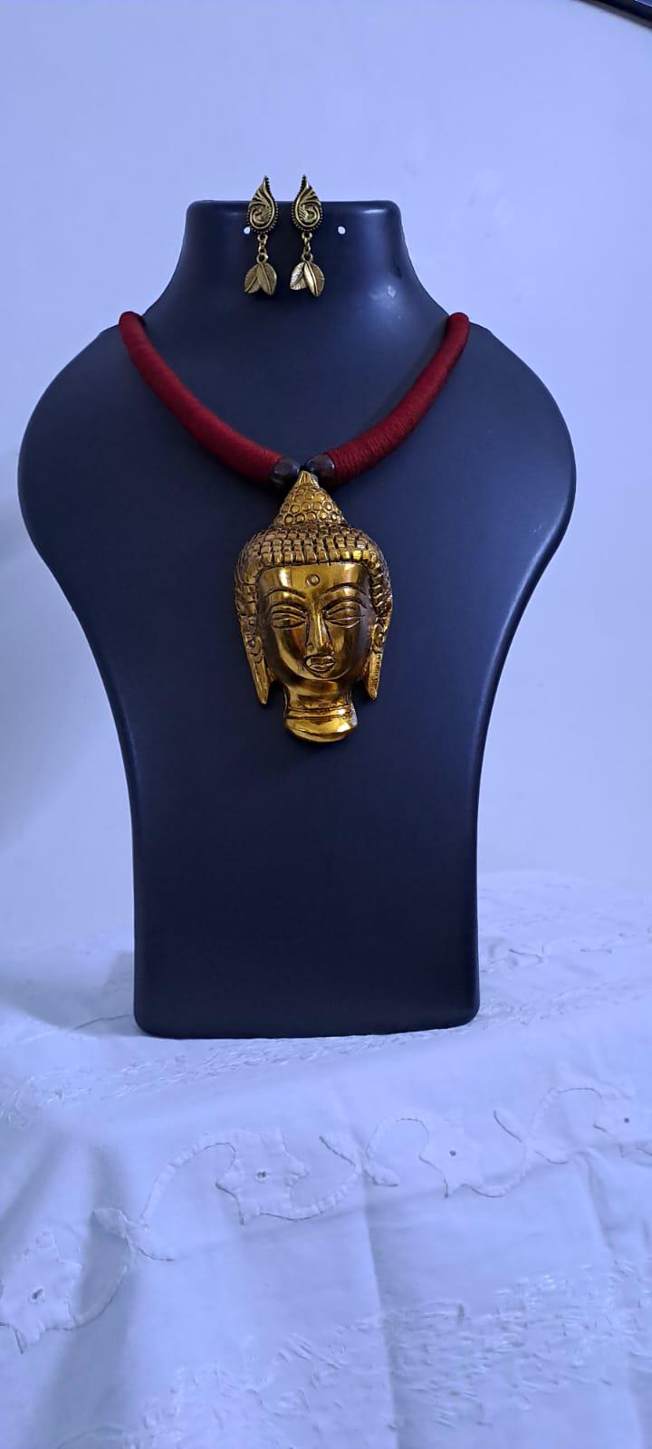 Maroon thread necklace with oxidised golden buddha pendant