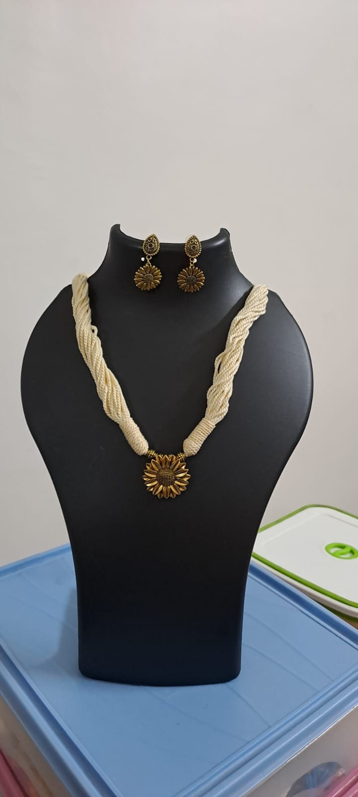 Off white thread necklace with oxidised silver sunflower pendant