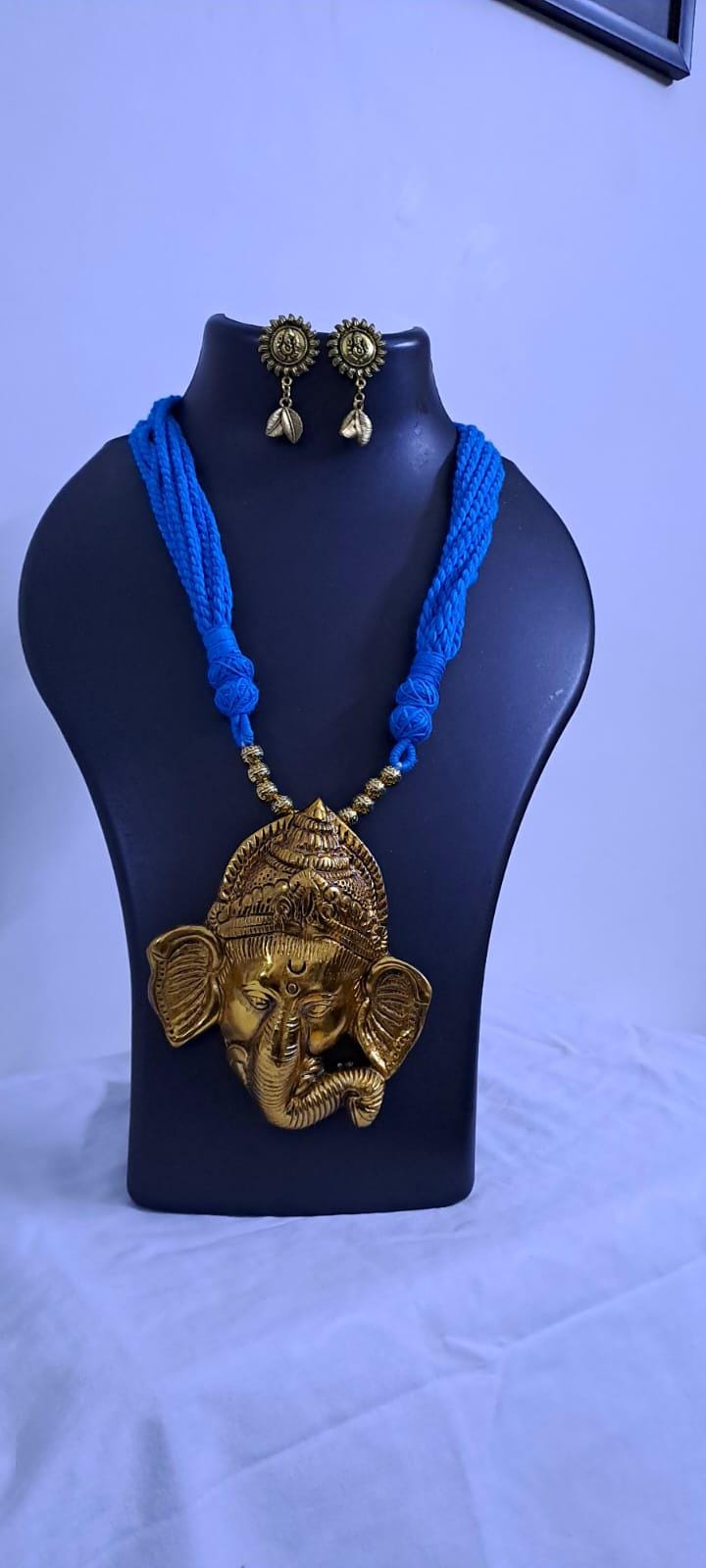 Blue thread necklace with golden oxidised ganesha pendant