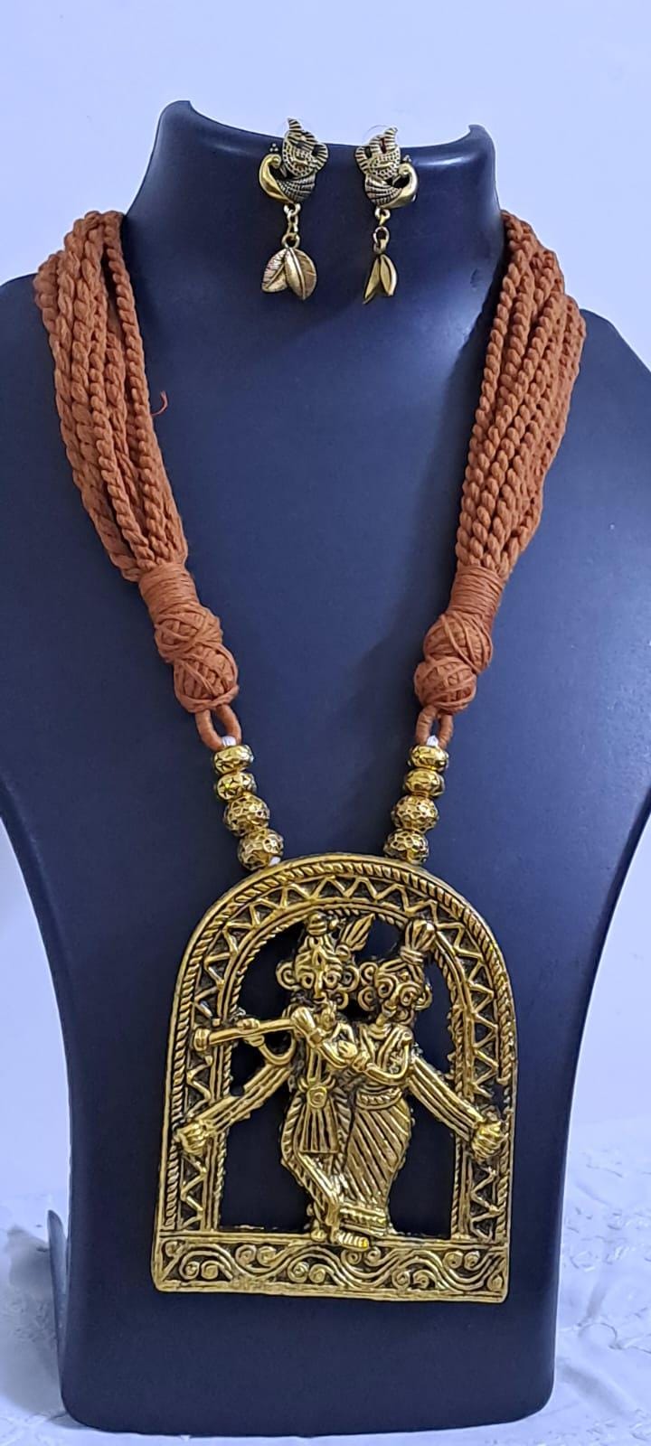 Radha Krishna golden oxidised pendant necklace in brown tread with matching earrings