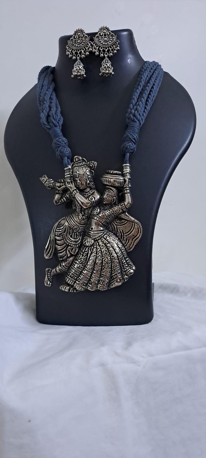 Radha Krishna silver oxidised pendant necklace in grey thread with matching earrings
