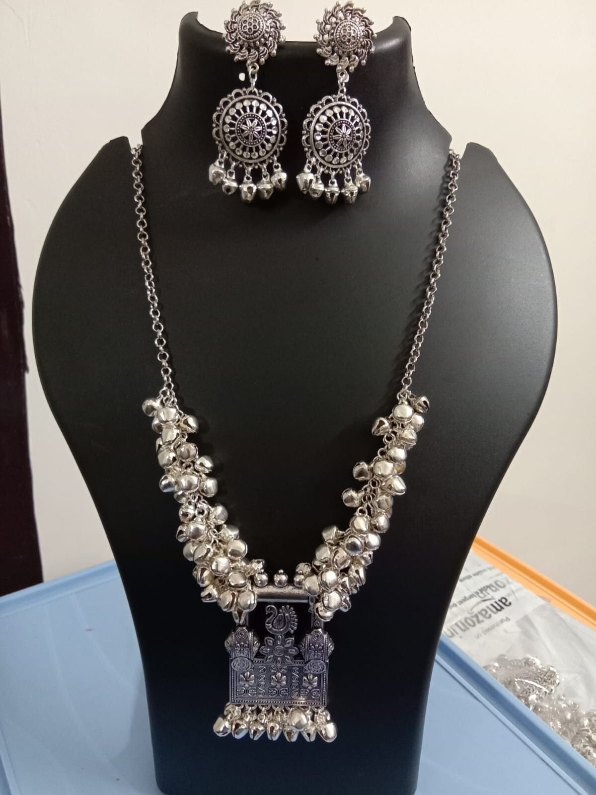 Oxidised silver chain with traditional pendant and matching earrings.
