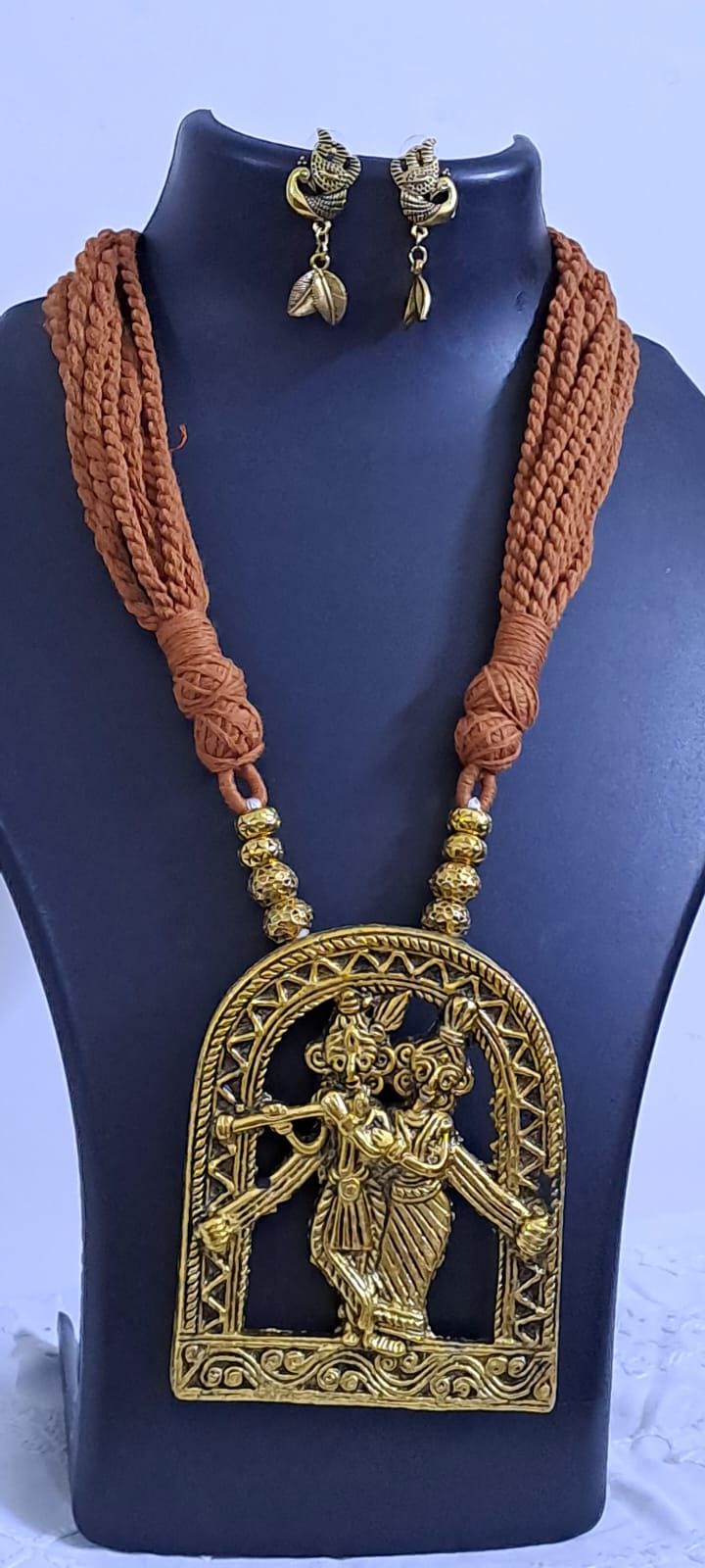 Radha Krishna golden oxidised pendant necklace in brown tread with matching earrings